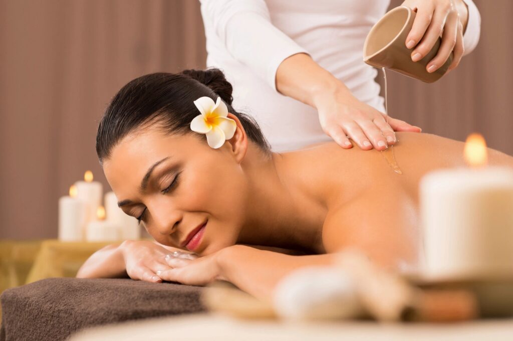 Woman enjoying relaxing spa massage session.