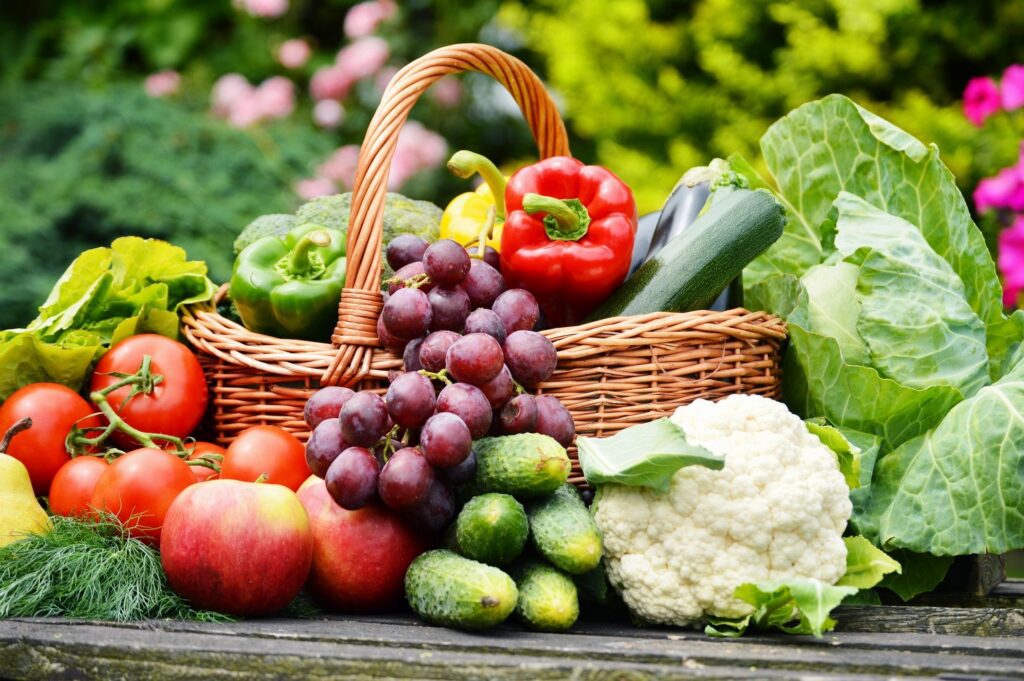 Basket of assorted fresh fruits and vegetables.