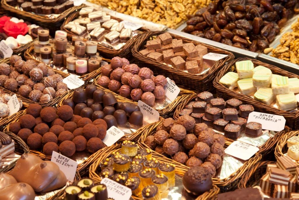 Assorted chocolates and sweets in baskets display.