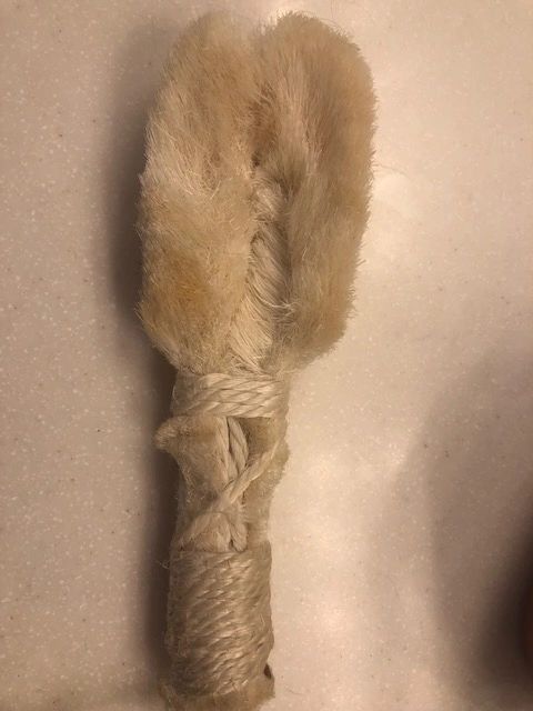 Furry toy resembling a rabbit's foot.