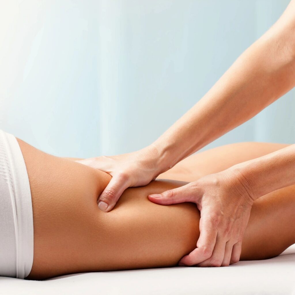 Leg massage therapy in a spa setting.