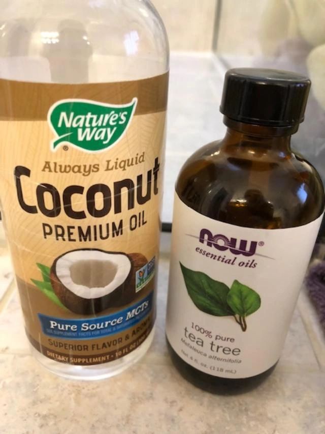 Coconut oil and tea tree oil bottles.