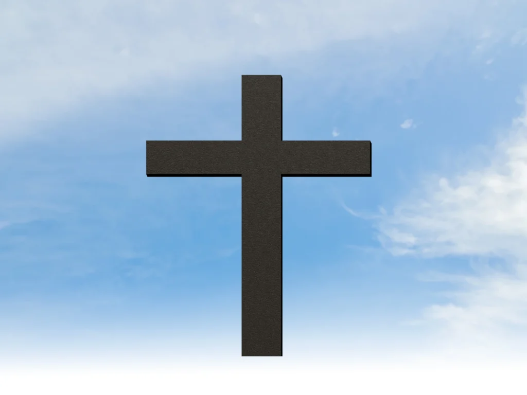Black cross against a blue sky with white clouds, creating a peaceful and serene atmosphere