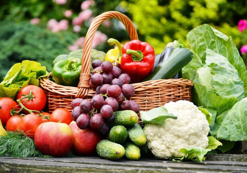 Basket of assorted fresh fruits and vegetables.