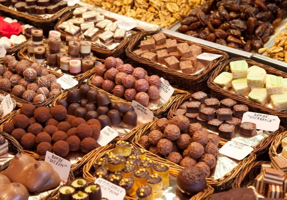 Assorted chocolates and sweets in baskets display.