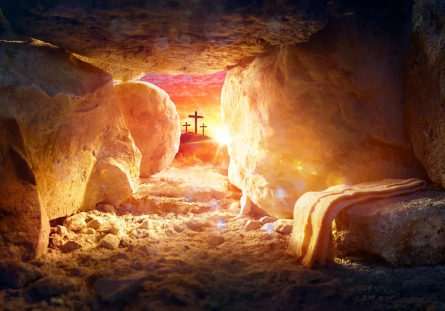 Cave with a cross in the middle of it, illuminated by the light of the sun