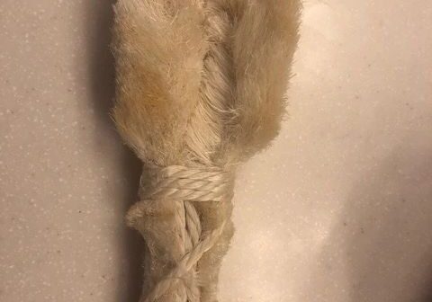 Furry toy resembling a rabbit's foot.
