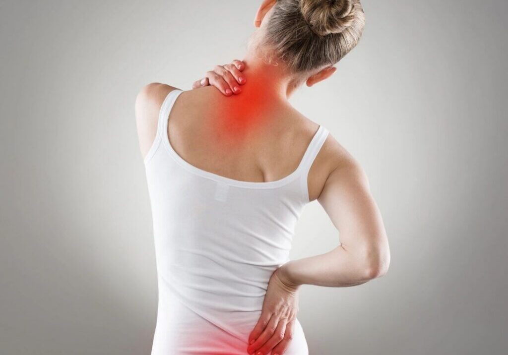 Woman with neck and lower back pain.