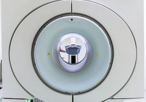 MRI machine tunnel view, hospital imaging equipment.