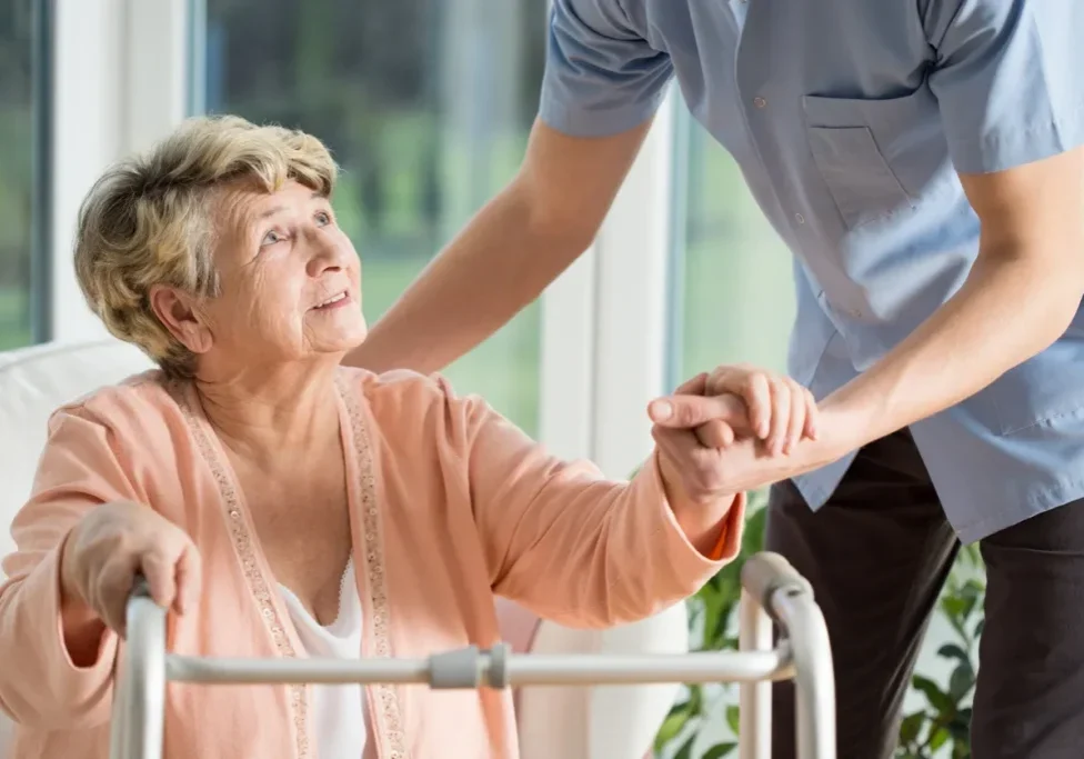 Elderly woman using a walker