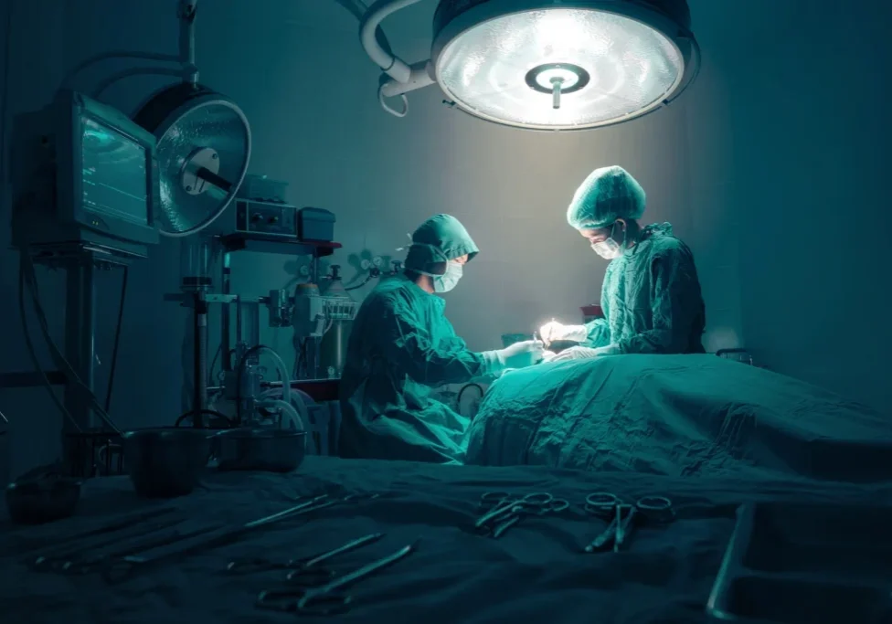 Two surgeons performing surgery in an operating room
