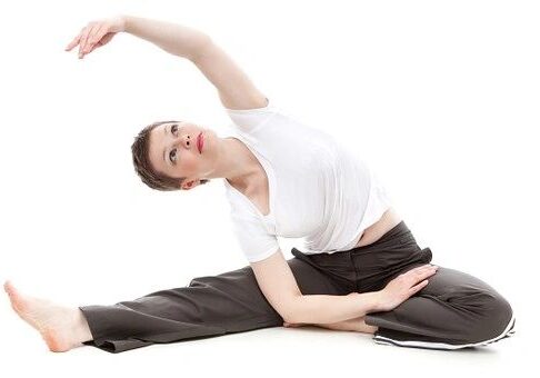 Woman doing a side stretch exercise.